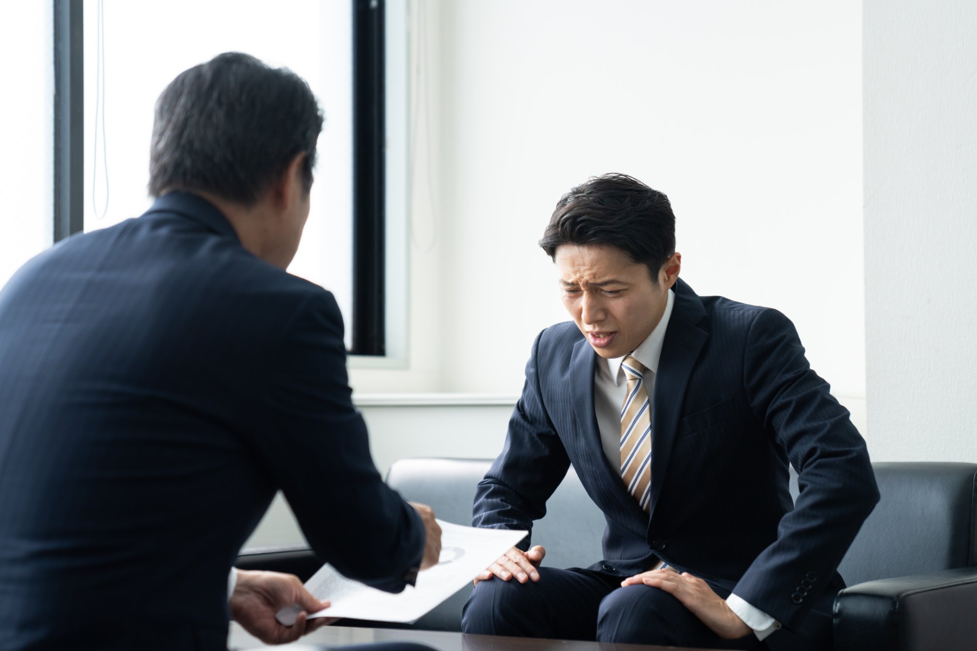 税務調査で困る男性
